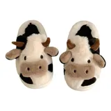 Pantuflas de peluche con diseño de vaca, confeccionadas en piel sintética suave. Cuentan con suela de goma antideslizante y diseño abierto en el talón.