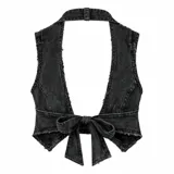 Conjunto de dos piezas compuesto por un chaleco tipo corset de denim lavado con cierre frontal de argollas metálicas y una minifalda de denim con diseño plisado, bordes deshilachados y correas laterales con hebillas.