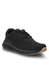 Championes deportivos de tejido knit color negro, con cordones y detalle de líneas rojas. Presentan una suela tecnológica con diseño ergonómico para mayor estabilidad y amortiguación.