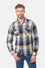 Sobrecamisa de estilo leñador con estampado de cuadros, confeccionada en tela de viyela. Presenta cuello clásico, cierre frontal con botones y dos bolsillos con solapa en el pecho.