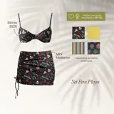 Conjunto de bikini compuesto por un corpiño con aros y una pollera corta tipo pareo con frunces laterales ajustables. El diseño presenta un estampado temático de rock con calaveras, labios y zapatillas sobre fondo negro. Confeccionado en lycra reciclada con protección solar.