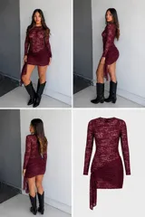 Vestido corto de encaje negro con mangas largas y cuello redondo. Presenta un diseño ajustado con un detalle de fruncido lateral en la falda que crea un efecto de caída asimétrica.