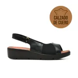Sandalia casual de cuero negro con plataforma baja y cómoda, tira trasera ajustable y detalles de tela en la capellada.