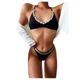 Conjunto de bikini negro con corpiño triangular con detalle de conchas y bombacha con doble tira y detalle de strass.