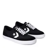 Championes urbanos Converse Net Star OX, color negro con detalles en blanco, confeccionados en lona y gamuza, con logo estrella característico en los laterales y suela de goma blanca.