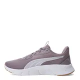 Championes Puma modelo Flex Focus Lite Modern, color negro con detalles en tono cobre. Presentan una suela blanca de espuma Pumalite ultraligera, parte superior de malla transpirable y plantilla SoftFoam+ para mayor amortiguación.