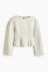 Top manga larga beige de interlock pesado con hombros caídos, escote redondo, pinzas moldeadoras en la cintura y bajo acampanado.