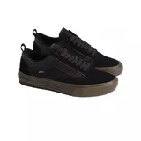 Championes Vans modelo Skate Old Skool con tecnología Wafflecup, color negro con detalles en marrón oscuro. Presentan una combinación de materiales en la capellada, incluyendo gamuza y tela técnica, con la clásica banda lateral de la marca y suela de goma reforzada.