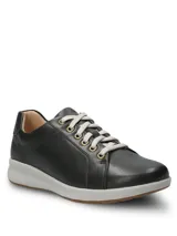 Championes Hush Puppies modelo Spinal Laceup de cuero color negro, con cordones grises, ojalillos metálicos dorados, entresuela gris y suela de goma.