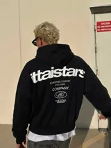 Campera con capucha negra, con cierre frontal y estampado gráfico en la espalda en color blanco con texto y diseño ovalado.