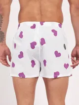 Bóxer de algodón blanco con estampado de flores pequeñas color celeste, con cintura elástica y logo de la marca en el centro.