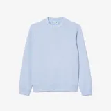 Buzo Lacoste celeste de corte clásico, confeccionado en algodón orgánico y poliéster reciclado. Presenta cuello redondo con inscripción de la marca y logo de cocodrilo en el pecho.