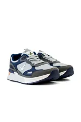 Championes deportivos Santa Barbara modelo Roma, en combinación de colores azul, gris y blanco, con detalles en naranja en la suela y logo lateral de la marca.