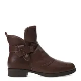 Botas de caña media confeccionadas en cuero negro, con interior forrado en corderito sintético color crema. Presentan un diseño con detalle de tira lateral con hebilla metálica y suela plana con pequeño tacón.