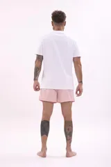 Short de baño color rosa pálido, con cordón de ajuste en la cintura.