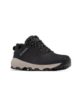 Championes Columbia modelo Newton Nimble Ltr, color negro con entresuela en tono beige. Presenta diseño de caña baja, exterior de cuero con perforaciones laterales para ventilación, cordones jaspeados y suela de goma con relieve para mayor tracción.
