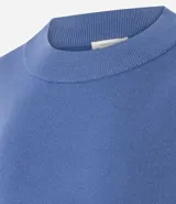 Buzo suéter de tricot con cuello redondo y puños ajustados, de diseño clásico y versátil.