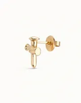 Aro piercing dorado con forma de cruz.