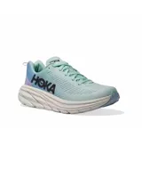 Championes de running Hoka Rincon 3, color celeste con detalles en lila y suela blanca.