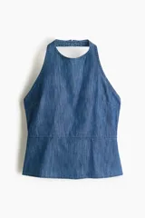 Top en denim de algodón suave con escote halter, cierre de botón en la nuca, pinzas en el busto y corte en la cintura.
