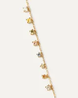 Collar dorado con cadena fina y ocho colgantes de circonitas cúbicas multicolores.