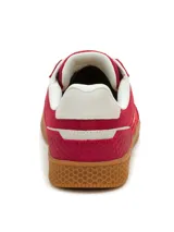 Championes Caterpillar modelo Pause Retro, de diseño minimalista con estética vintage. Confeccionados en una combinación de lona y cuero, presentan una base de goma resistente con textura hexagonal y cierre mediante cordones.