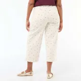 Pantalón de corte wide leg color blanco con estampado floral pequeño, de tiro alto y diseño de cinco bolsillos.