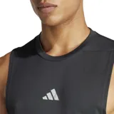 Musculosa deportiva Adidas color negro, con cuello redondo y logo de las tres barras en blanco en el pecho. Presenta un tejido texturizado y aberturas amplias en las sisas.