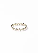 Anillo fino de plata 925 con baño de oro 18k, diseñado con una estructura de pequeños círculos metálicos alternados con zirconias engastadas en todo su contorno.