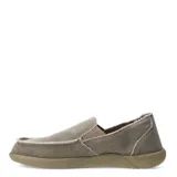 Zapatos tipo slip-on de tela color beige, con diseño de bordes deshilachados y suela de goma al tono.