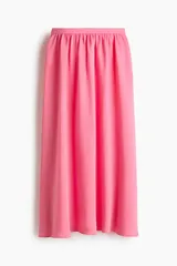 Pollera tobillera de corte holgado en mezcla de viscosa, de color fucsia, con cintura de tiro alto fruncida y elástico revestido en la parte posterior.