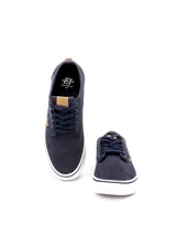 Zapatillas casuales de caña baja, color negro, con capellada de textil y suela de PVC blanca. Presentan cordones negros y detalles en cuero sintético marrón en la lengüeta.