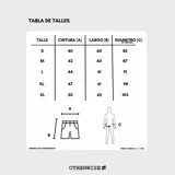 Bermuda de corte baggy color marrón con efecto gastado (lavado vintage), doble carpintero y detalle artesanal visible en el bajo. Incluye un cordón extra confeccionado en la misma tela.