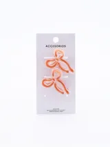 Par de pinzas para el pelo color naranja con forma de moño.