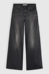 Jean de tiro alto con diseño wide leg, color negro con efecto deslavado, confeccionado en denim con bajo nivel de elasticidad.