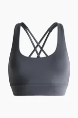 Top deportivo H&M con SoftMove™ Medium Support, color gris oscuro, con escote redondo y tirantes finos dobles cruzados en la espalda.