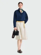 Cartera tipo tote XS Longchamp de la línea Épure Timeless, color negro, con asas superiores y correa ajustable y desmontable en tono marrón oscuro.