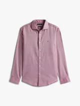 Camisa de manga larga Tommy Hilfiger con corte regular, confeccionada en algodón con tejido dobby texturizado. Presenta un micro estampado de puntos en tono rojizo, cuello clásico con botones y logo de la marca bordado en el pecho.