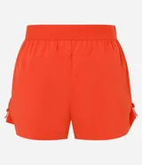 Bermuda deportiva color naranja, confeccionada en tejido técnico transpirable con tecnología Dry. Presenta cintura elástica, bolsillos laterales y cordones laterales ajustables que permiten fruncir el largo de la prenda.