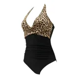 Malla entera de color verde oscuro, combinada con un diseño floreado en la parte inferior. Presenta escote halter cruzado y fruncidos en la zona del abdomen.