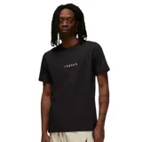 Remera de manga corta Jordan, color negro, con cuello redondo y estampa minimalista con el logo y nombre de la marca en el centro del pecho.