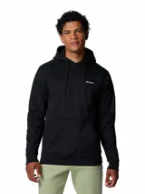 Buzo con capucha Columbia, modelo Meridian Creek, de color negro. Presenta un diseño clásico con bolsillo frontal tipo canguro, puños y dobladillo acanalados, y el logo de la marca bordado en el pecho.