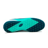 Championes de fútbol Austral modelo Blast TF, color turquesa con detalles en azul oscuro y blanco, diseñados con suela de tapones de goma para superficies sintéticas.