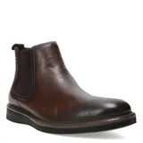 Botas tipo Chelsea de cuero color marrón, con paneles elásticos laterales y suela de goma con detalle de costura en el borde.