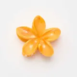 Pinza para el pelo con diseño de flor de tiaré, en tono naranja jaspeado y acabado brillante.