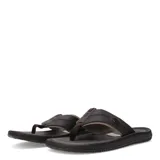 Sandalias tipo ojota para hombre, con tiras anchas de textura granulada y detalle de logo metálico circular. Presentan una plantilla ergonómica y suela con relieve antideslizante.