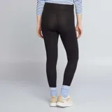 Calza larga de punto liso color negro, con cintura alta para mayor comodidad durante el embarazo.