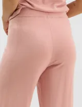 Pantalón tejido de corte recto y diseño fluido, color amarillo, con cintura ancha elastizada.