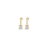 Aros colgantes dorados con dije de cristal blanco.