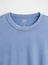 Remera de manga larga Gap, confeccionada en algodón de gramaje pesado, con cuello redondo y puños elásticos.